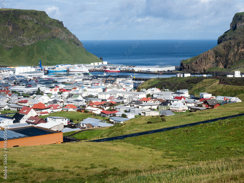 Wall mural Panoramic view of Heimaey town and harbor on Heimaey Island - Westman Islands, Iceland