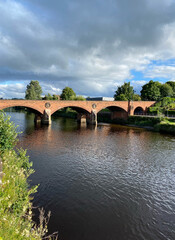 Fototapeta na wymiar old bridge over river in scotland