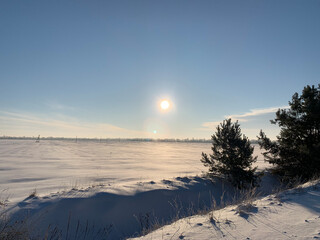 Peaceful sunrise at snowy field