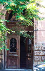 Fototapeta na wymiar Old door with carving in Tbilisi