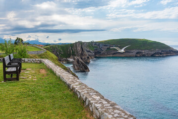 Bench on the Paseo de San Pedro, Llanes, overlooking the cliffs in the Cantabrian Sea, Asturias.