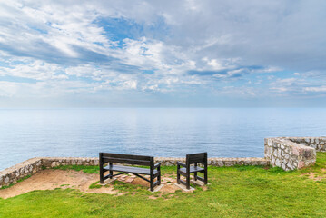 Benches on the Paseo de San Pedro, Llanes, with views of the Cantabrian Sea, Asturias.