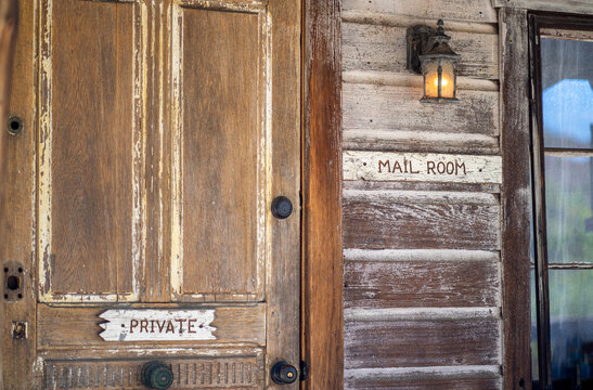 Vintage Old Wooden Mail Room Entrance To A Building With Lantern