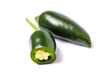 two halapeno peppers lie on a white background