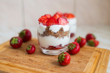 delicious homemade dessert with cream and strawberries in a glass