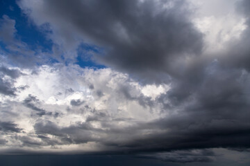 Storm cloudy epic dramatic sky with cumulus dark and white clouds and blue sky background texture, thunderstorm, heaven	
