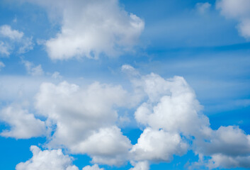 Blue sky with white cumulus clouds moving fast in day light. Cloudscape. Nature background. Windy weather forecast. Religion concept. Heaven landscape. Fresh air. Morning inspiration. Daylight