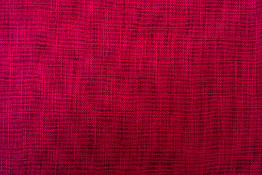 magenta red fabric texture background, pattern. Abstract design background of linen sack textile canvas burlap cloth. Close-up, mock up, top view