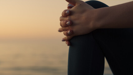 Closeup stretching woman foot in front calm ocean. Slim girl warming up body.