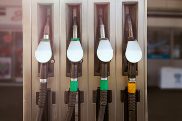 pump gas station with full nozzles to refill tank of car with gasoline and benzine mockup - obrazy, fototapety, plakaty