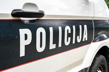 Police car on the street. Front view of a police car. Police patrol car parked on the street. © Ajdin Kamber