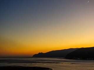 Fototapeta na wymiar Golden sunset at Troia Beach, Setubal, Portugal. Wonderful colors.