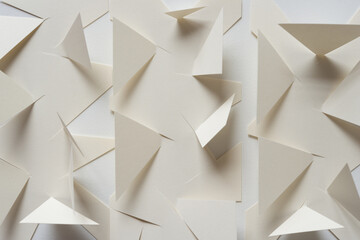 abstract paper background (cut edges, triangle shapes)