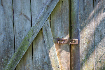 Old wooden door with bolt, concept background