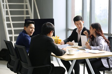 Businessman Giving Speech On Business Meeting With Colleagues, Discussing Work Ideas And Projects, Making Presentation Standing In Modern Office. Teamwork, Entrepreneurship, Corporate Meeting