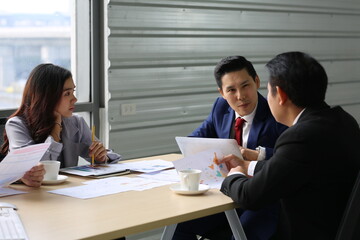 Businessman Giving Speech On Business Meeting With Colleagues, Discussing Work Ideas And Projects, Making Presentation Standing In Modern Office. Teamwork, Entrepreneurship, Corporate Meeting
