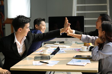 Young Asian business team people meeting in office