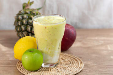 colorful healthy fresh fruit smoothy with assorted ingredients serve in glass.