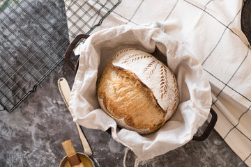 Yeast-free bread with a beautiful pattern, rich pastries at home on a black grate in the kitchen.