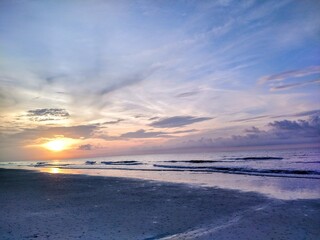 Peaceful Beach Sunrise Over Waves