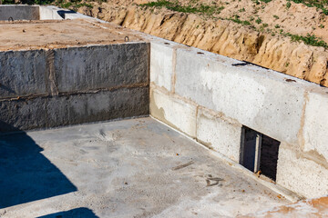 Strip foundation of a new building from concrete foundation blocks. The foundation for the construction of the walls of the house.