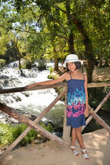 Asian girl posing in a river in Spain
