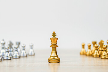 King chess stand on chessboard concepts of competition challenge of leader business team or teamwork volunteer or wining and leadership strategic plan and risk management or team player.