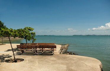 Fototapeta na wymiar empty bench on sea beach