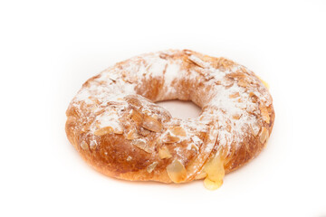 Round bun with custard, powder and almonds