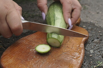 Slicing Zucchini. Preparations For The Winter A Mixture Of Vege