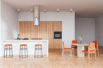 Kitchen interior with countertop and dining table with chairs on wooden floor