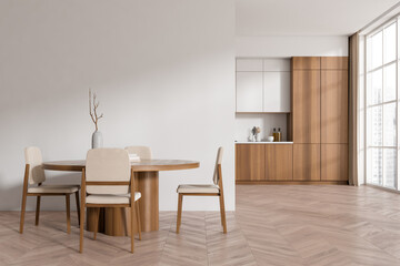 Light kitchen interior with dining table and seats, panoramic window. Mockup