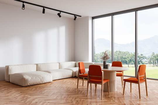 Light meeting interior with couch, eating zone and panoramic window. Mockup