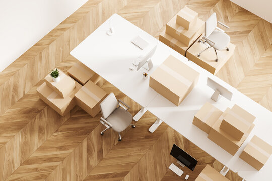 Top View Of Office Interior With Armchair And Moving Boxes