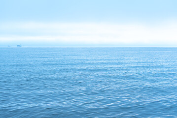 Obraz premium Nature background with blue sea against cloudy sky