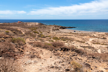 Panoramic sea view on Abades beach in Poris de Abona on the east coast of Tenerife, Canary Islands, Spain. Hiking trail leading to a pebble beach in a remote holiday resort. Sunny day, summer vacation