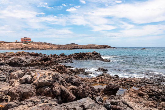Panoramic sea view on Abades beach in Poris de Abona on the east coast of Tenerife, Canary Islands, Spain. Sharp stone beach in a remote holiday resort. Sunny day, summer vacation. Snorkeling location