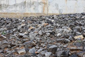 A low angle view against a background of large granite boulders piled up. © kaentian