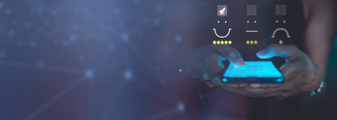 Business Woman pressing face emoticon on virtual touch screen at smartphone .Customer service...