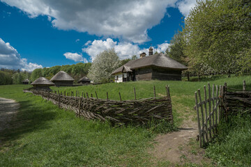 The path leads to the wooden house