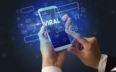 Hand using smartphone with social media concept