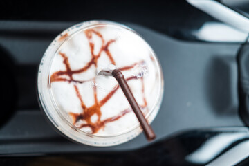Iced Mocha coffee in the personal car from the drive-through coffee shop