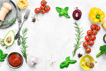 Food background. Fresh vegetables on a gray stone background. Top view. Free space for text.