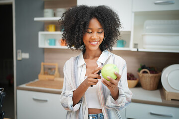 Portrait of a beautiful female fashion model with curly hair at home