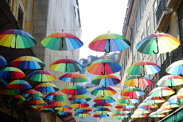 Fototapeta na wymiar Rainbow umbrellas in Lisbon, Portugal