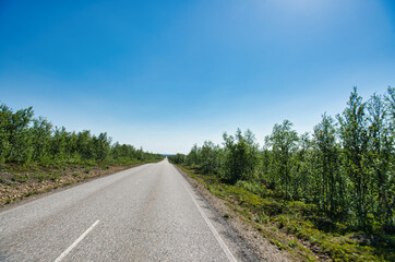 Fototapeta na wymiar Road in nice weather in Finnmark, Finland