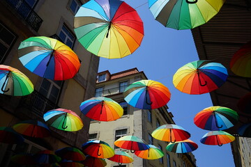 Rainbow umbrellas in Lisbon street, Portugal