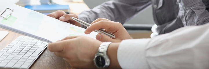 Boss reading new candidate application for work on vacant position in company