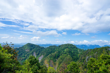 mountains with sky and clouds as seen from Tiger Cave Temple (Wat Tham Sua) in Krabi, Thailand.