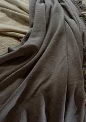 background from natural fabrics. cozy fabrics in pastel and autumn shades with texture and light defocus for the background